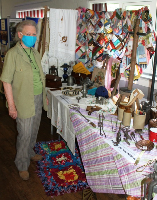 Elaine with household items from the past